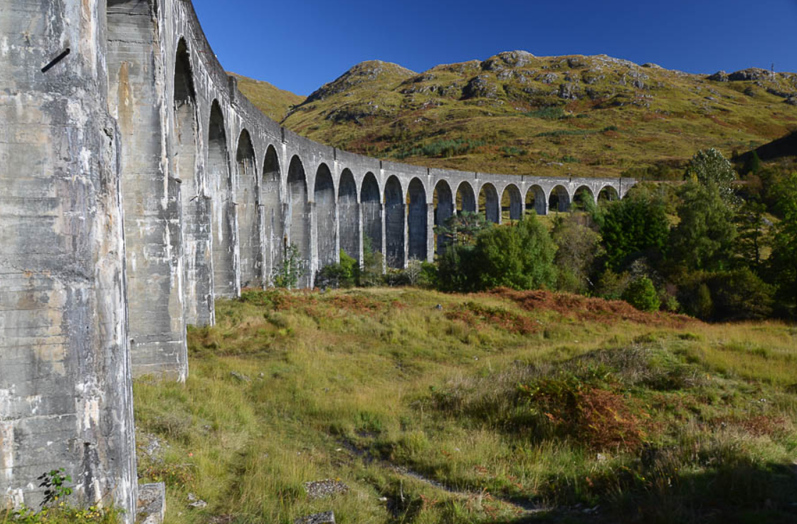 Glenfinnan Viaduct Trail, an impressive viaduct curves through the Scottish countryside, part of our list of dog friendly walks.